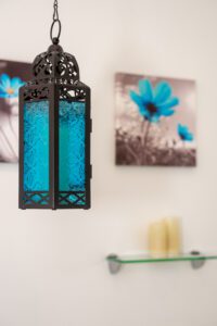 blue glass and bronze light fixture