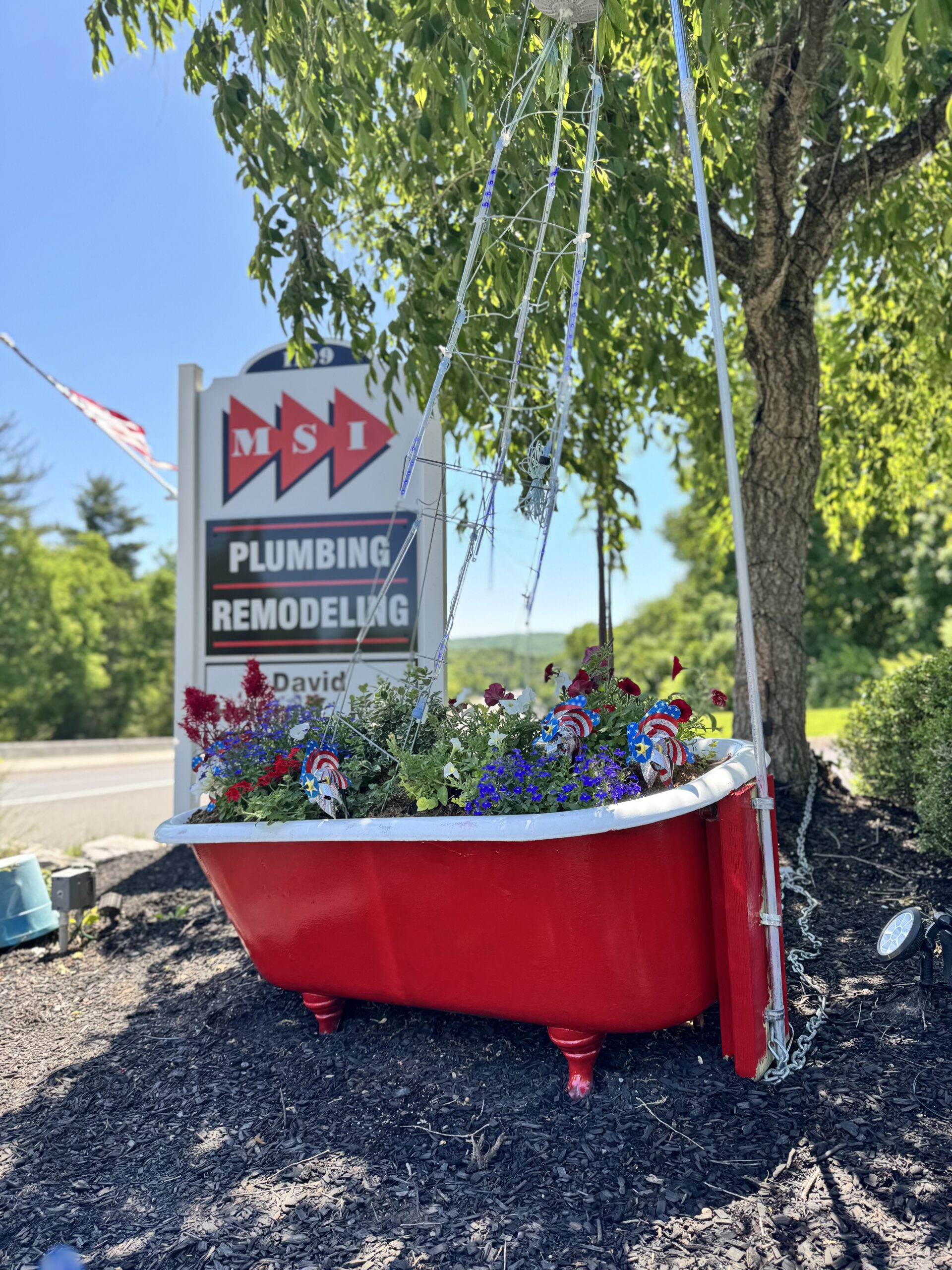 Kohler 1922 red cast iron tub with flowers and lights mimicking water flowing from showerhead