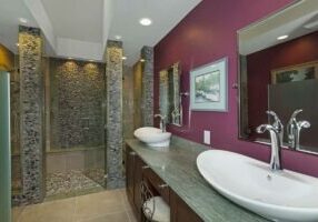 bathroom with double sink and shower